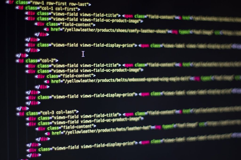 computer-coding-270632 Detailed close-up of HTML code on a computer monitor, showcasing web development.